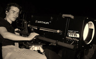 The followspot operator, Gaspard Juan, at the controls of the Arthur Robert Juliat followspot at the Domaine d'O. Photo © Mathieu Cabanes